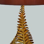 Lamp to lay on the foliage of golden ferns