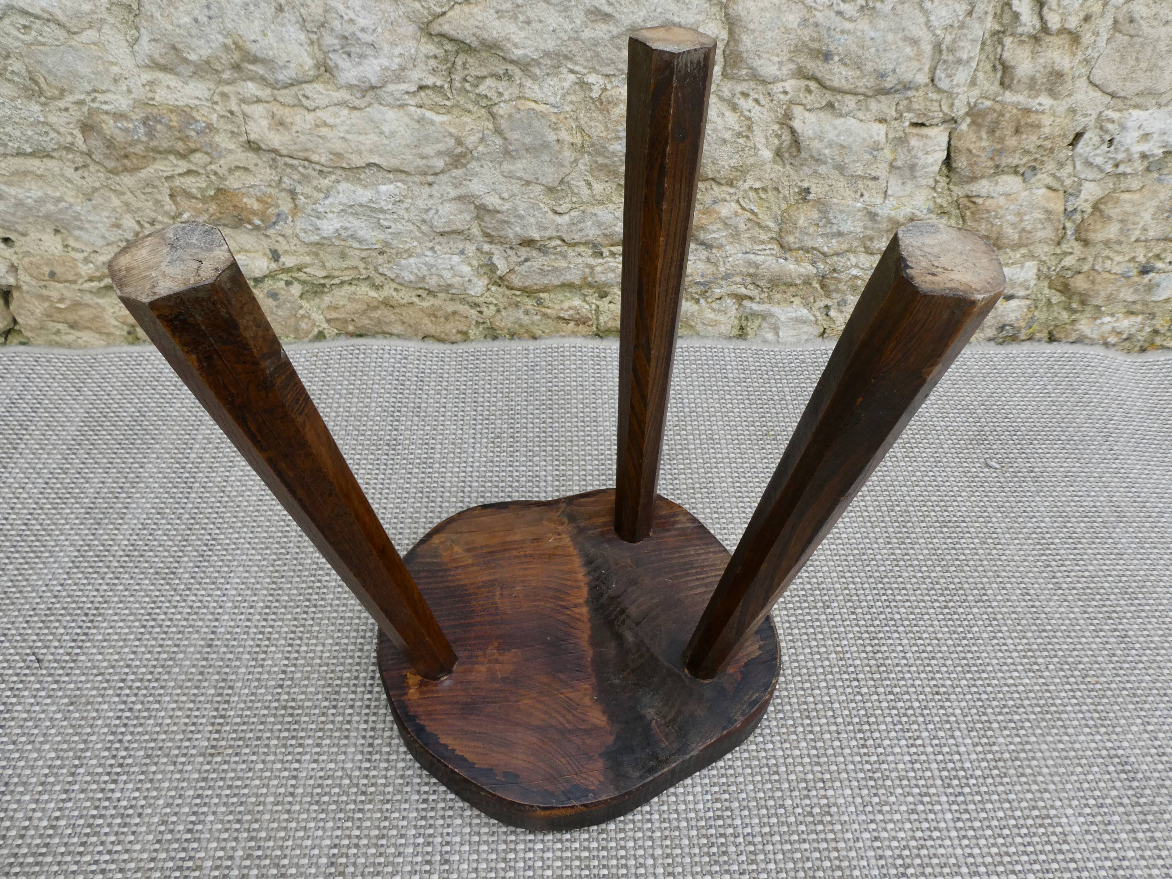 Tripod stool in raw wood