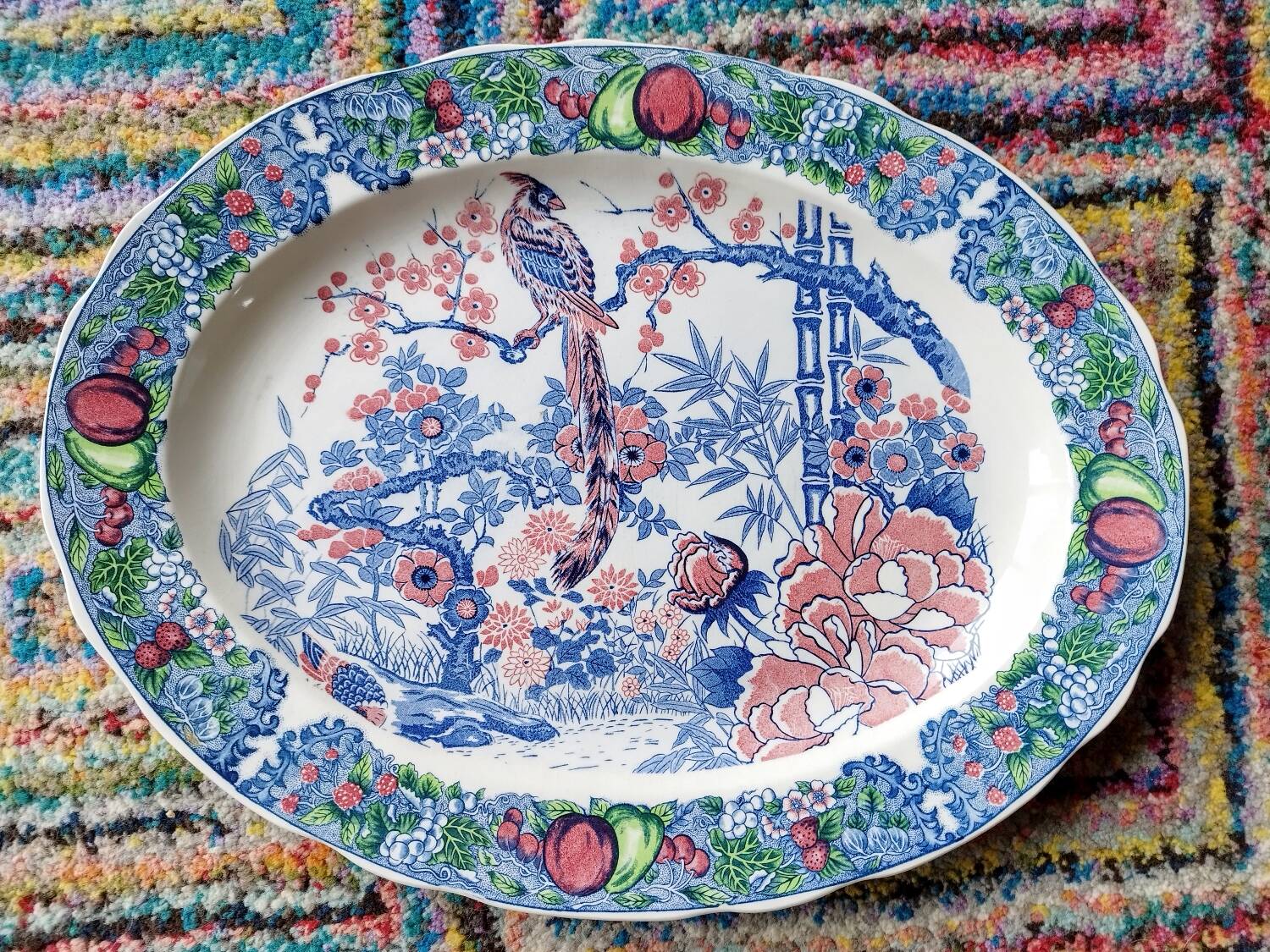 Oval Japanese plate with peacock decoration.