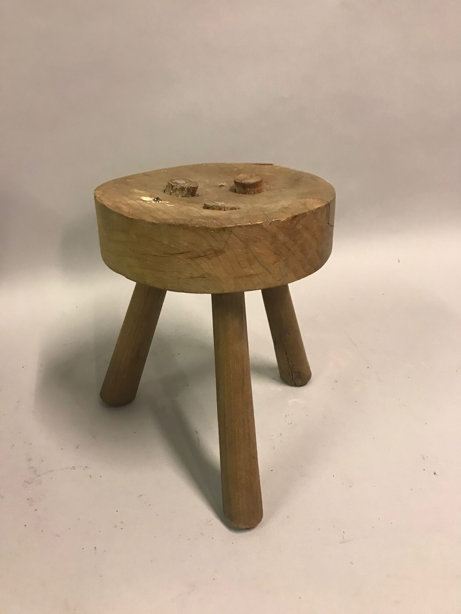 Two raw tripod stools