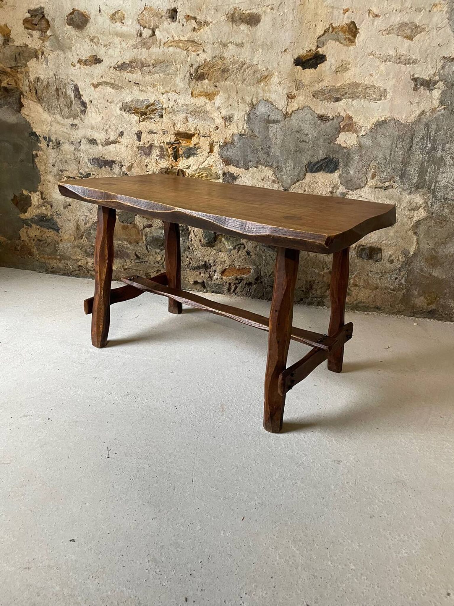 Small rustic table made of solid wood.