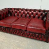 Three-seater red leather chesterfield sofa