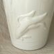 Thick white porcelain vase with relief decoration of a flying duck.