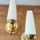 Pair of sconces with a light arm, brass and white opaline 1960.