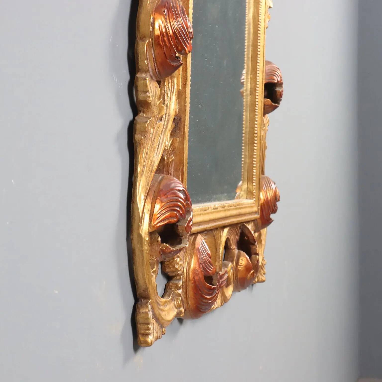 Antique baroque style mirror in carved wood, Italy, 20th century.