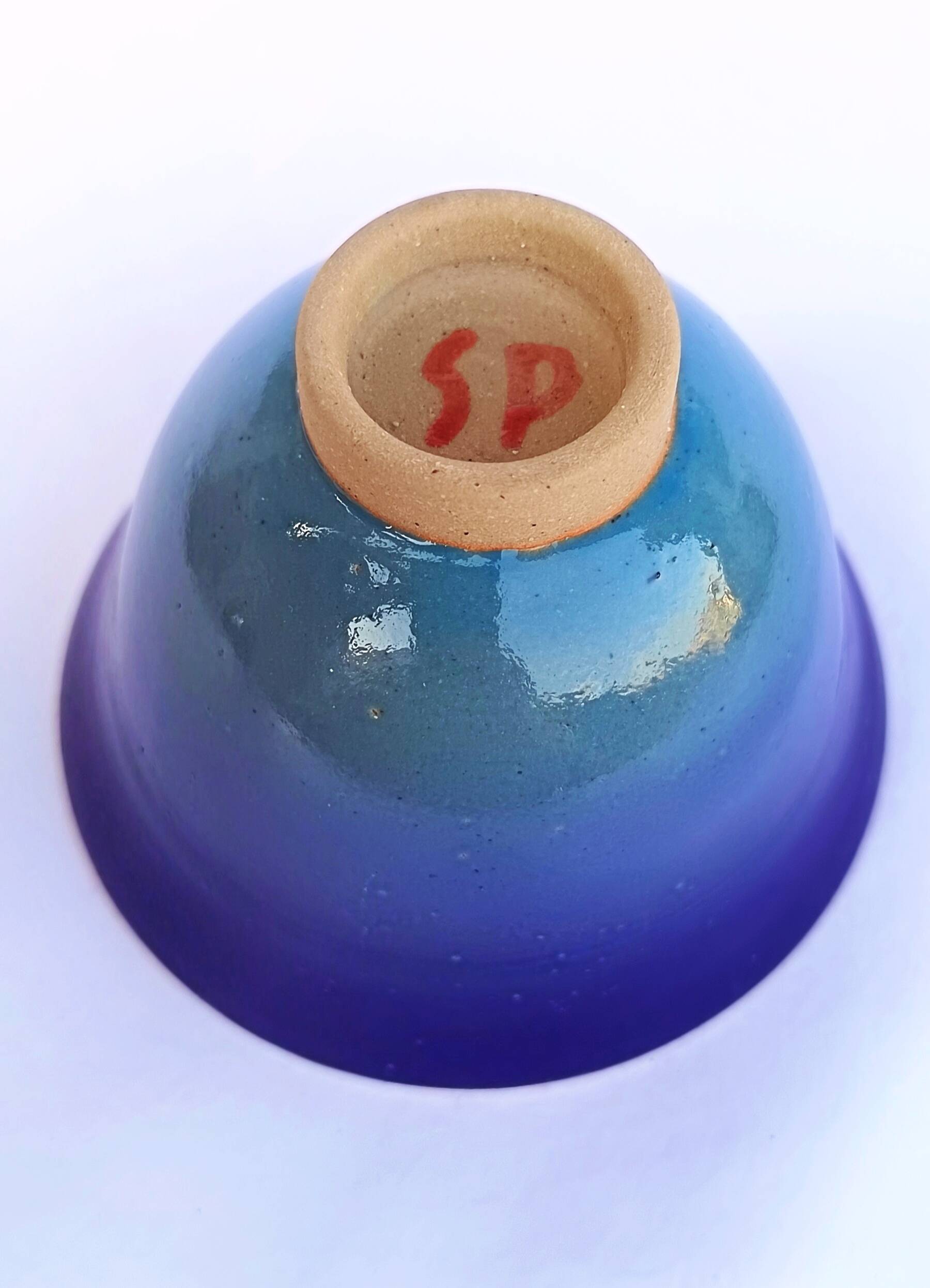 Blue glazed stoneware bowl on a foot, signed SP, Puisaye.