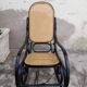 Rocking-chair noir canné bois courbé 1930