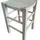 Vintage wooden stool with white peeling paint