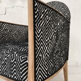 Club armchair in wood and fabric.