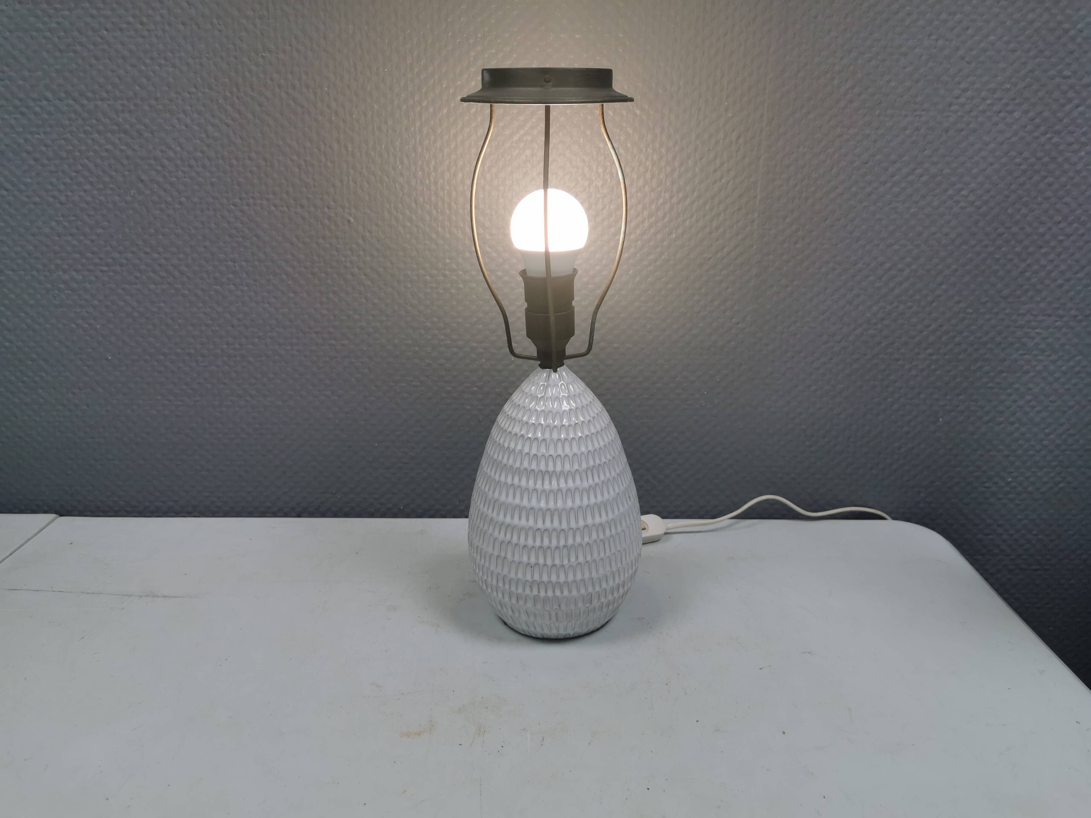 Older ceramic table lamp with beautiful details.