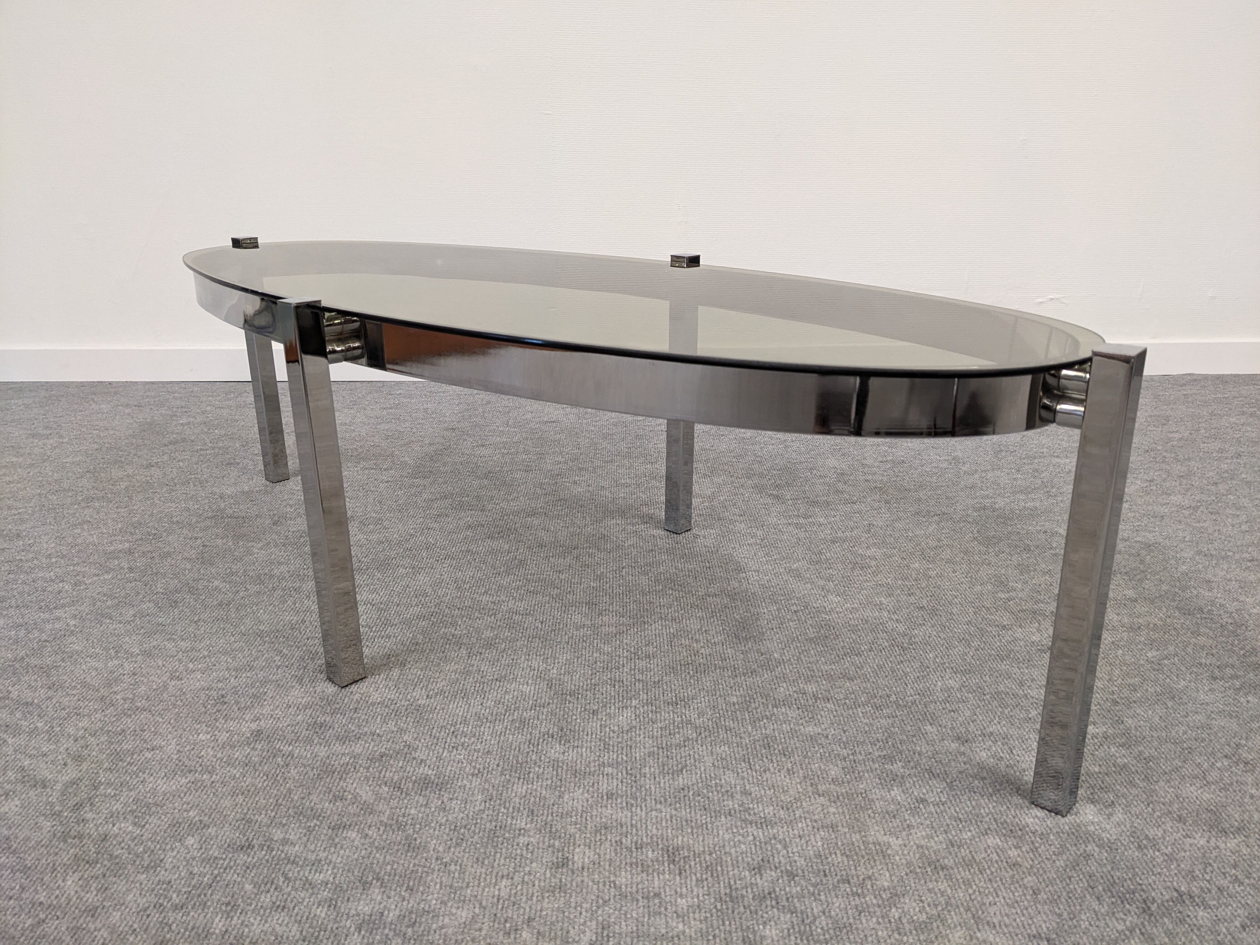 Oval smoked glass coffee table from the 60s/70s