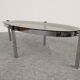 Oval smoked glass coffee table from the 60s/70s