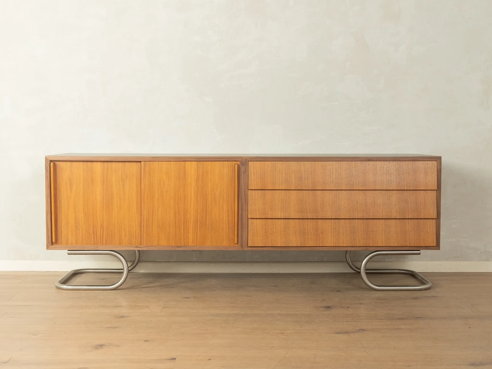 Striking mid-century sideboard with stainless steel base