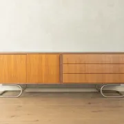 Striking mid-century sideboard with stainless steel base