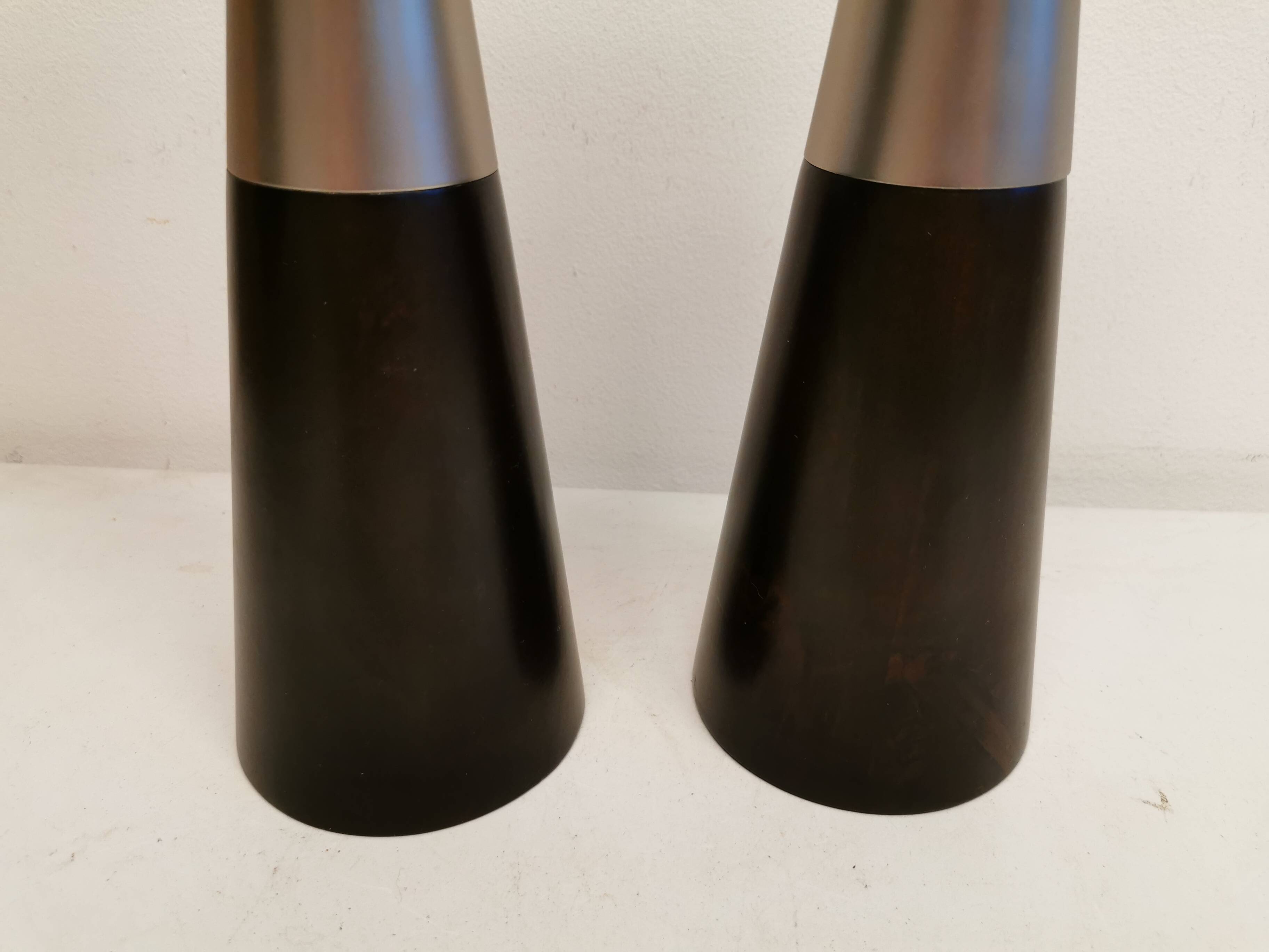 Two table lamps made of dark-stained wood with silver detail in the middle.