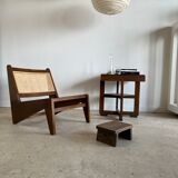 Reclined armchair in canned teak in natural wood