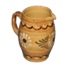 Glazed terracotta pitcher decorated with friezes and flowers