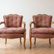 Pair of antique Louis XV armchairs in wood and pink fabric.