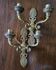 Pair of chiselled bronze wall sconces with palmette decoration.