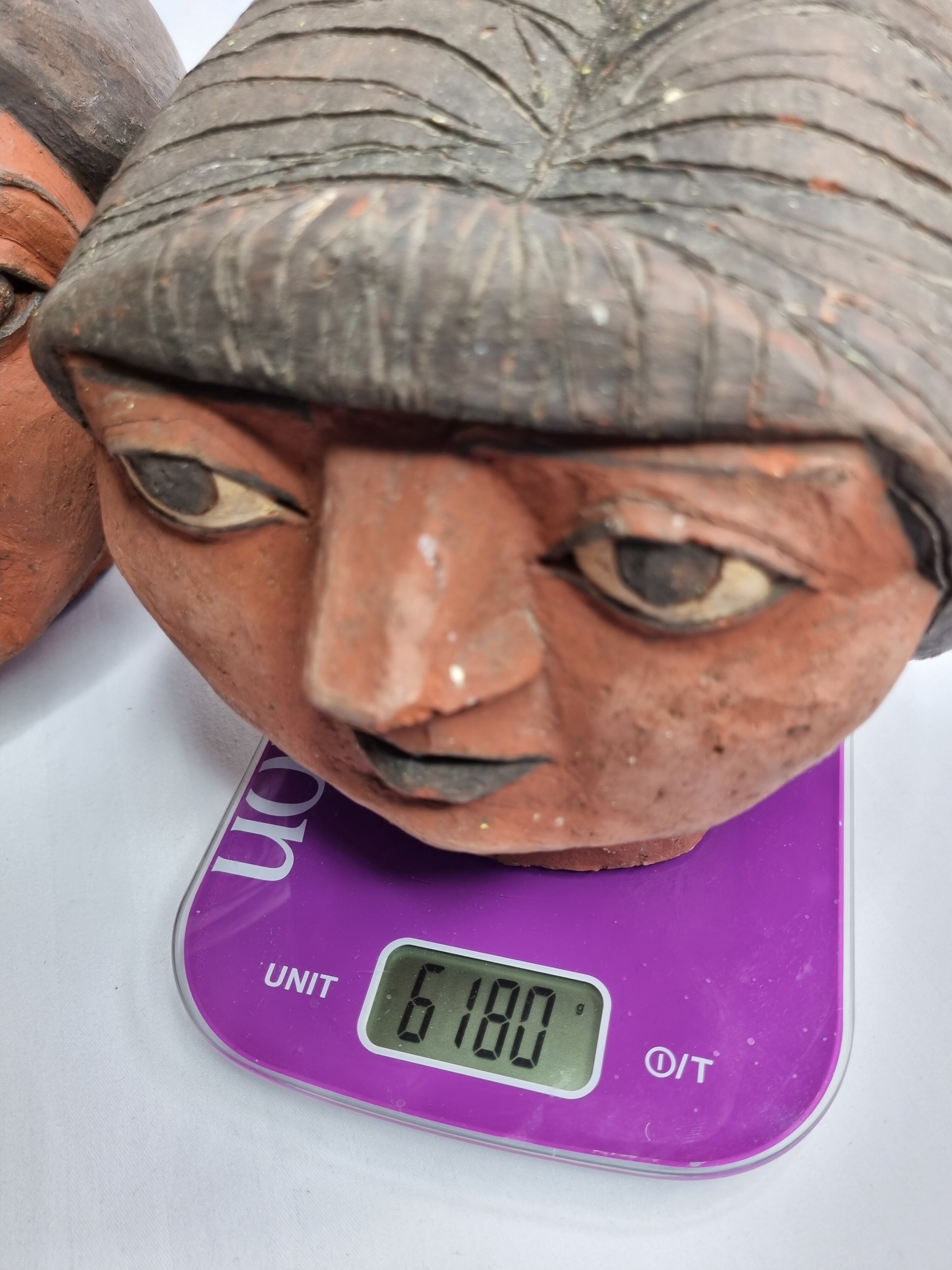 Set of 3 decorative women's heads in red terracotta