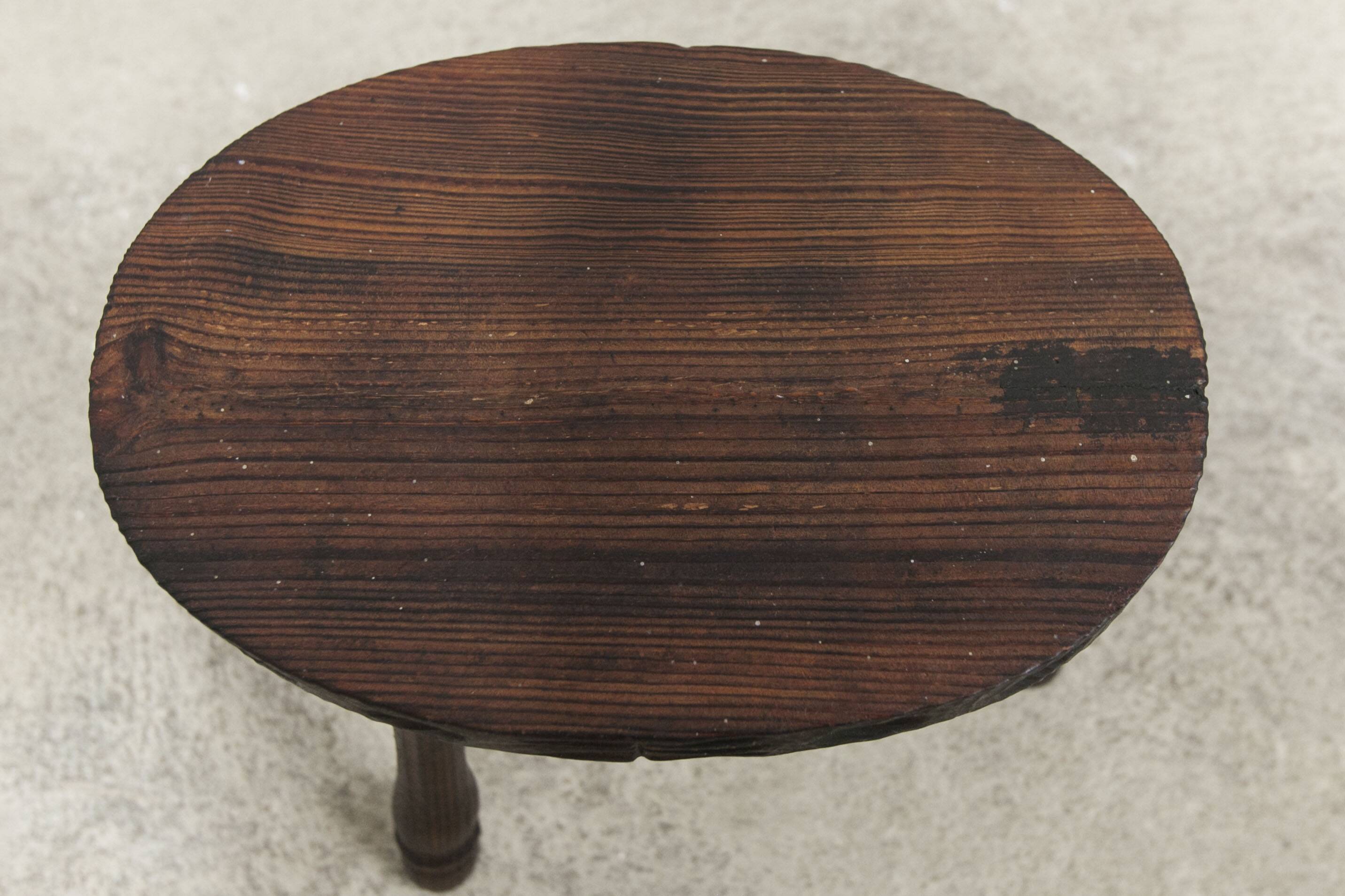 Low brutalist solid wood stool 1950