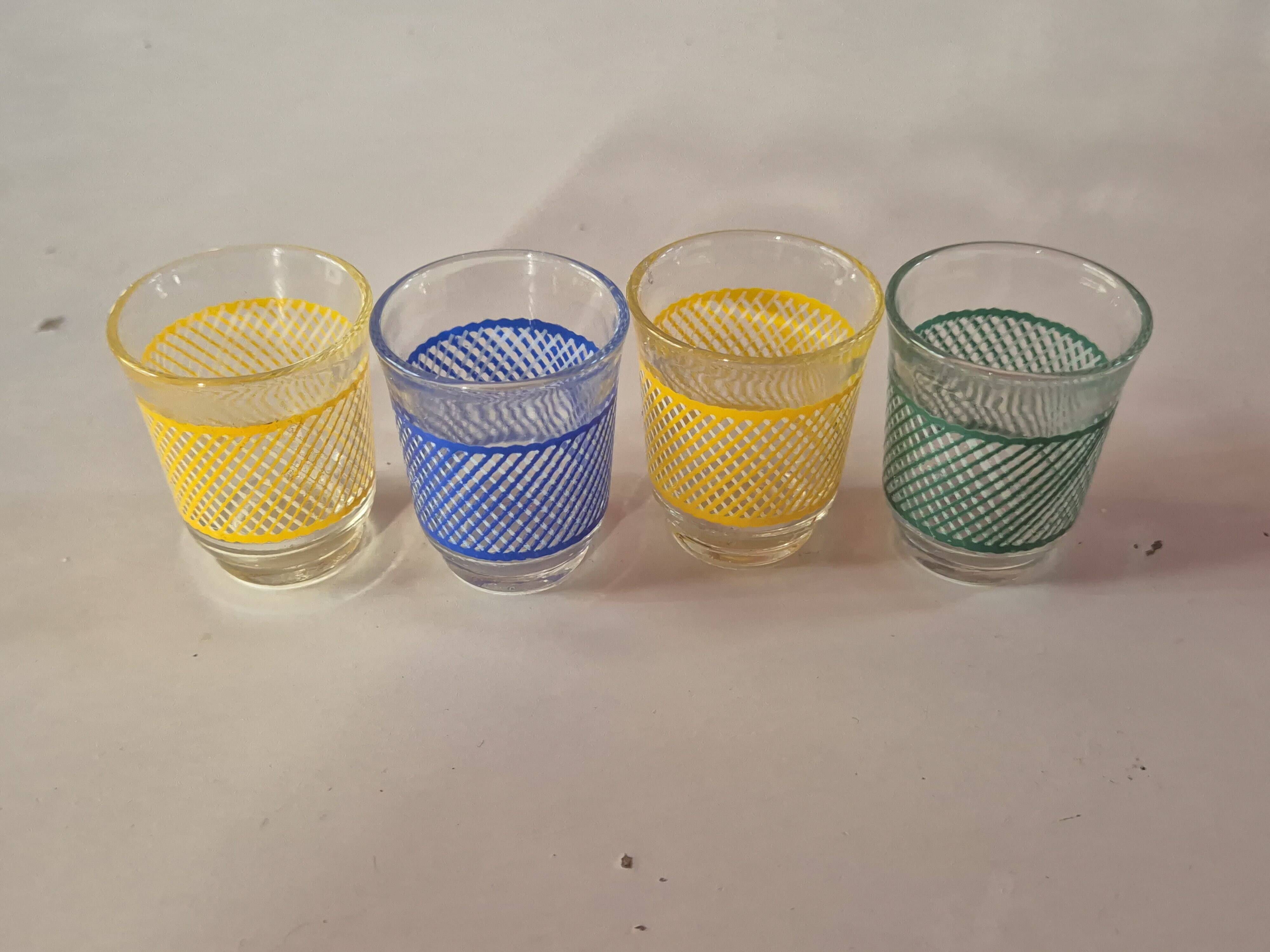 set of 4 vintage liqueur glasses in yellow, green, and blue