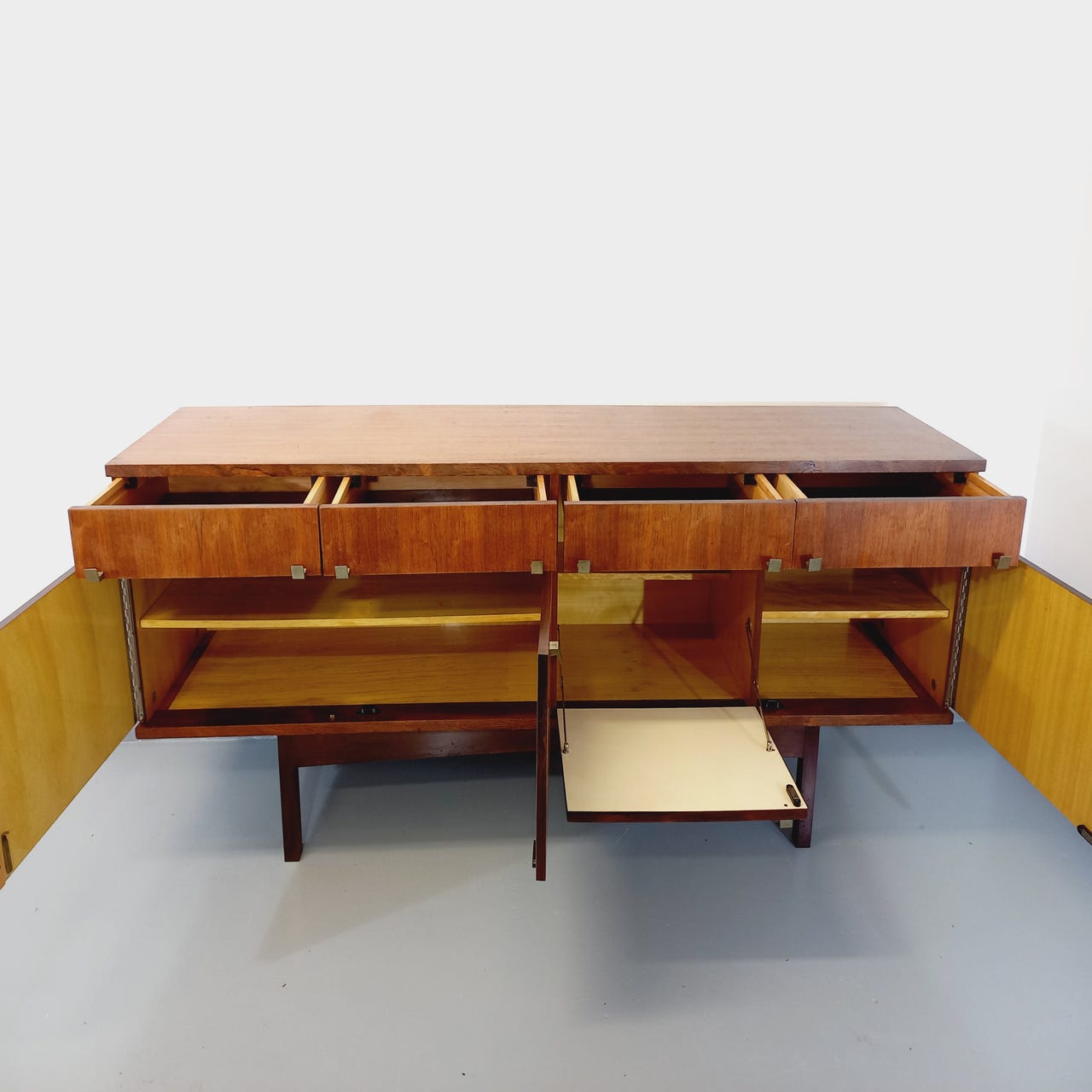 Vintage Scandinavian style row in rosewood and brass from the 60s