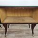 Mid-century mahogany bedside tables with mirrored tops.