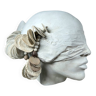 Stylized head in white biscuit, artist's work