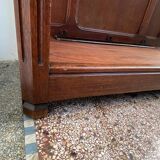 Antique wooden coat rack with mirror and shelf.