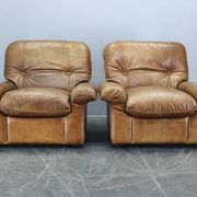 Paire de fauteuils lounge en cuir buffle cognac Arcon Italia