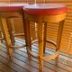 Set of 4 bar stools in solid exotic wood and red leather.