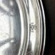 Oval silver-plated metal dish monogrammed "EM"