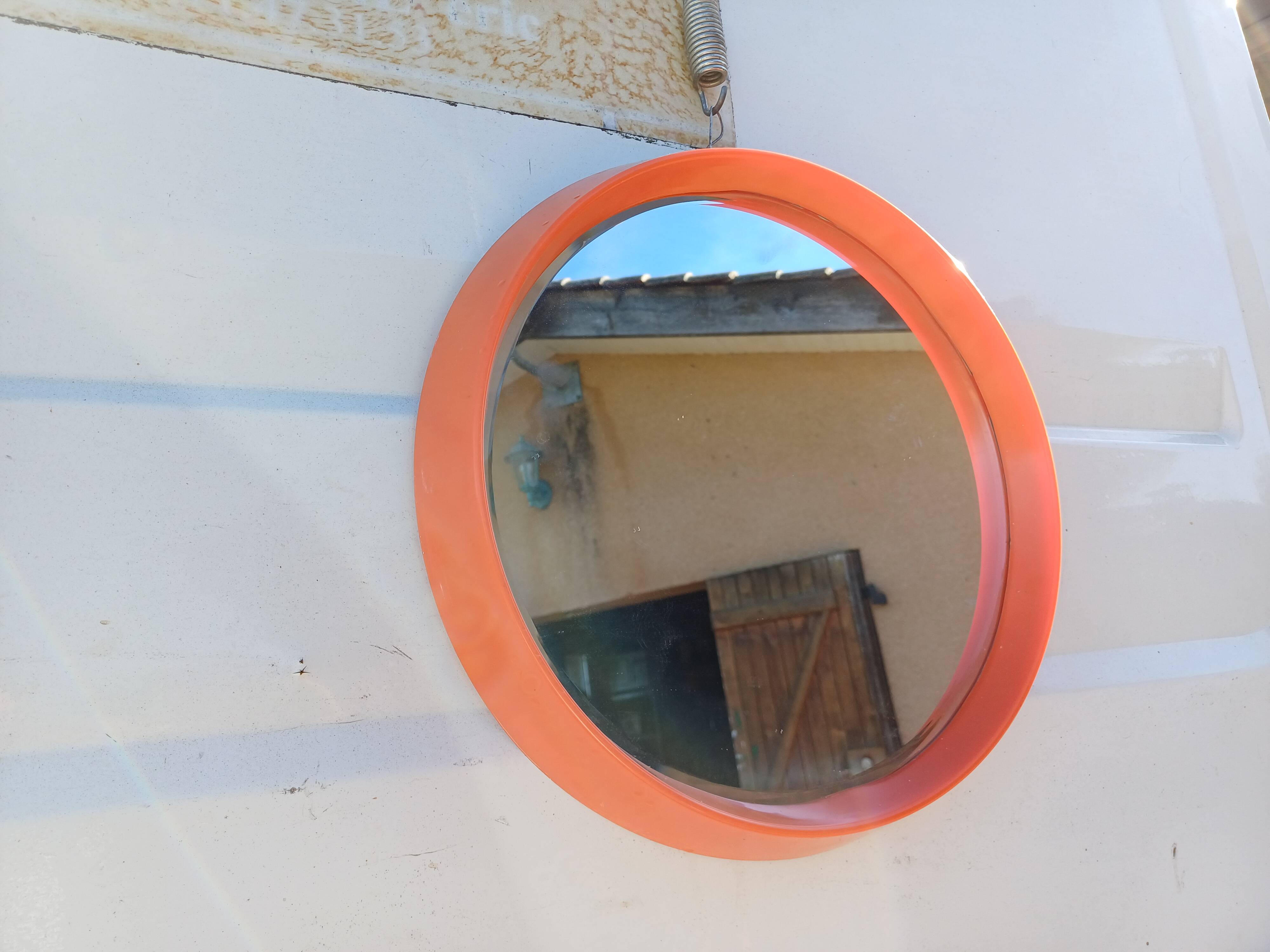 Vintage round plastic orange mirror