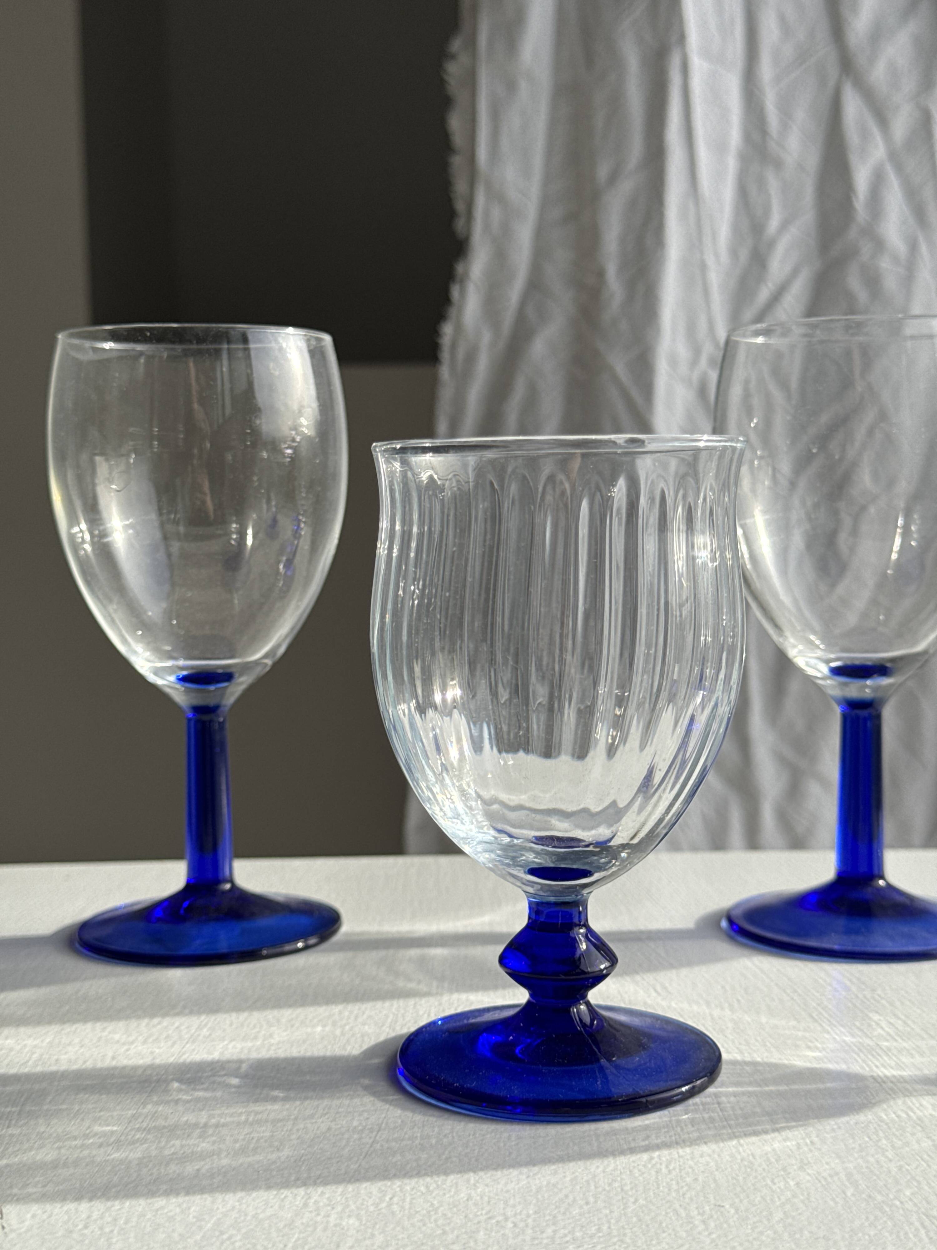 Set of 3 large blue stemmed glasses and 3 small blue stemmed glasses