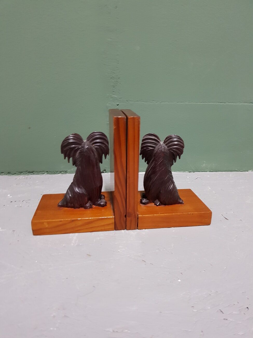 Mid 20th century wooden bookends with carved sitting dogs