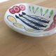 Ceramic bowl, fish and raw vegetables