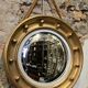 Witch mirror porthole style in gilded wood, diameter 44 cm.
