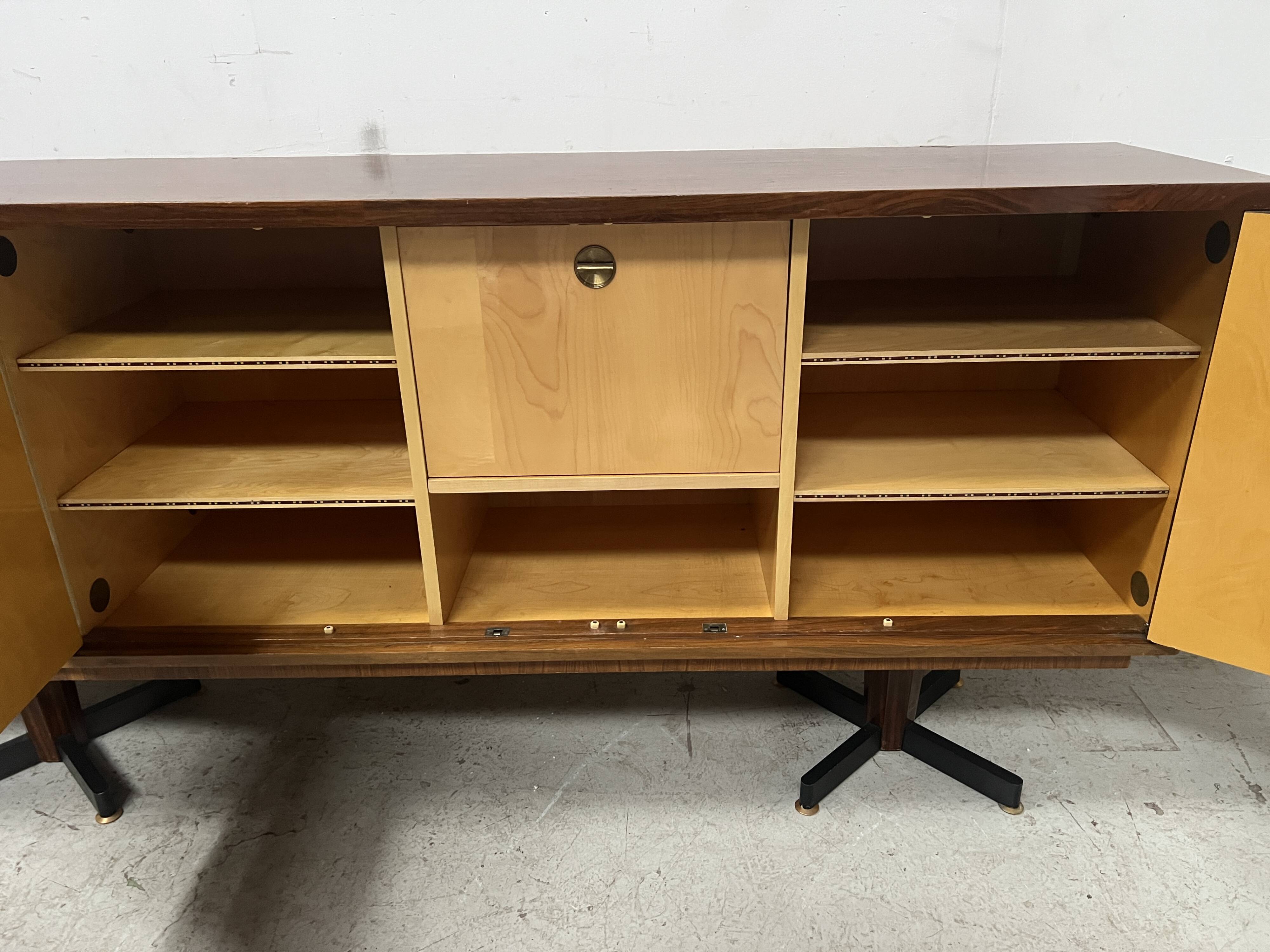 Scandinavian enfilade in veneered wood with iron legs, 20th century.