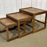 Set of 3 nesting tables in teak with tiled tops.