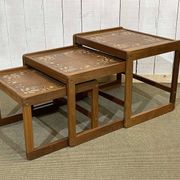 Set of 3 nesting tables in teak with tiled tops.