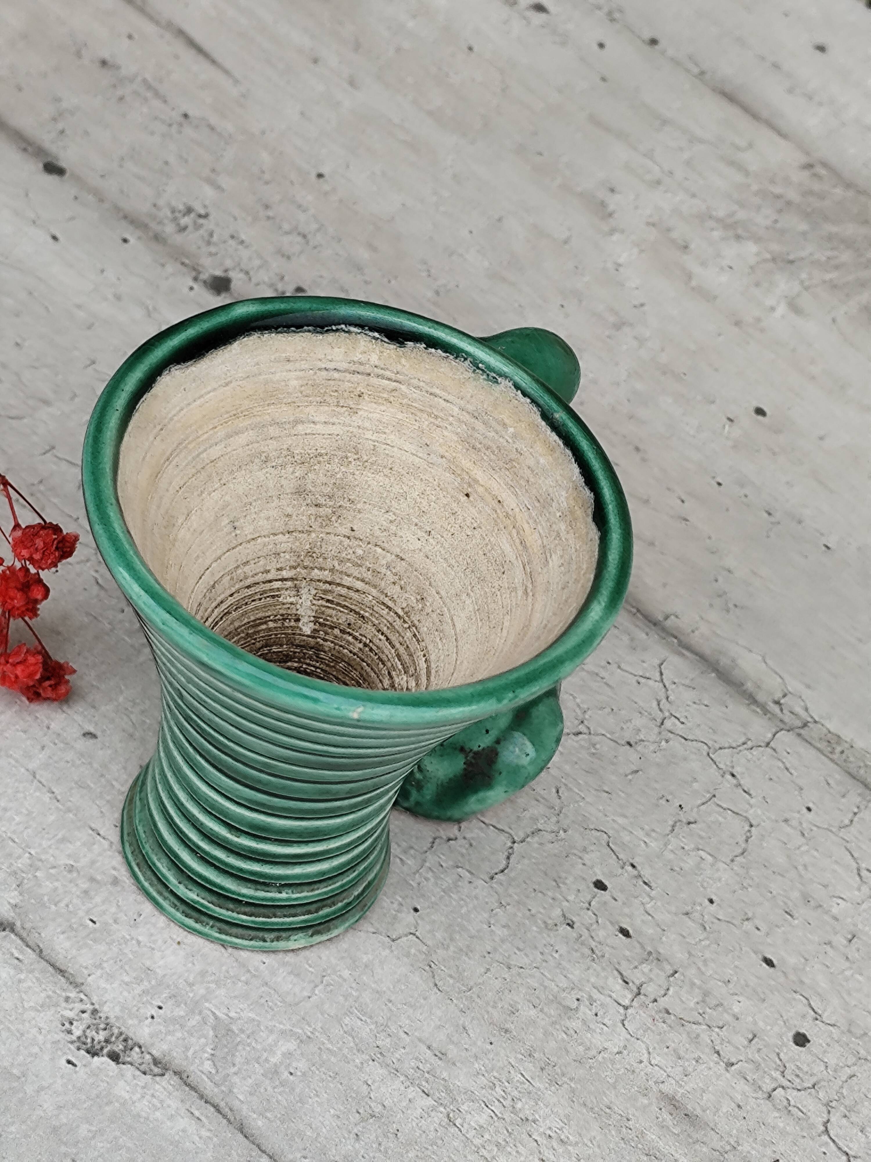 Green ceramic empty pocket dog statue