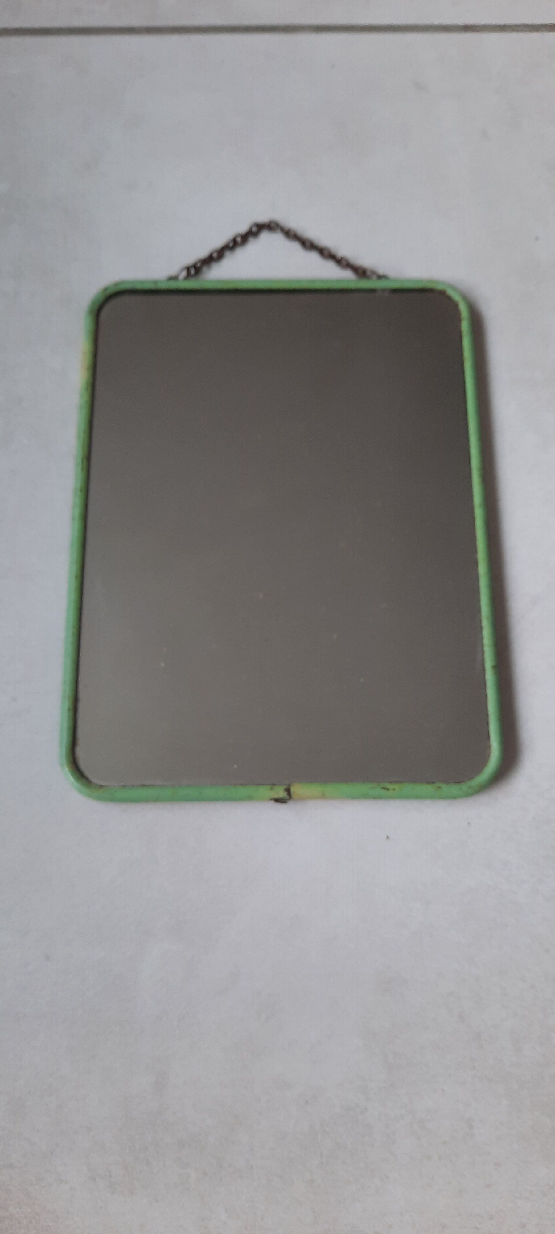 Old barber mirror of mint green color