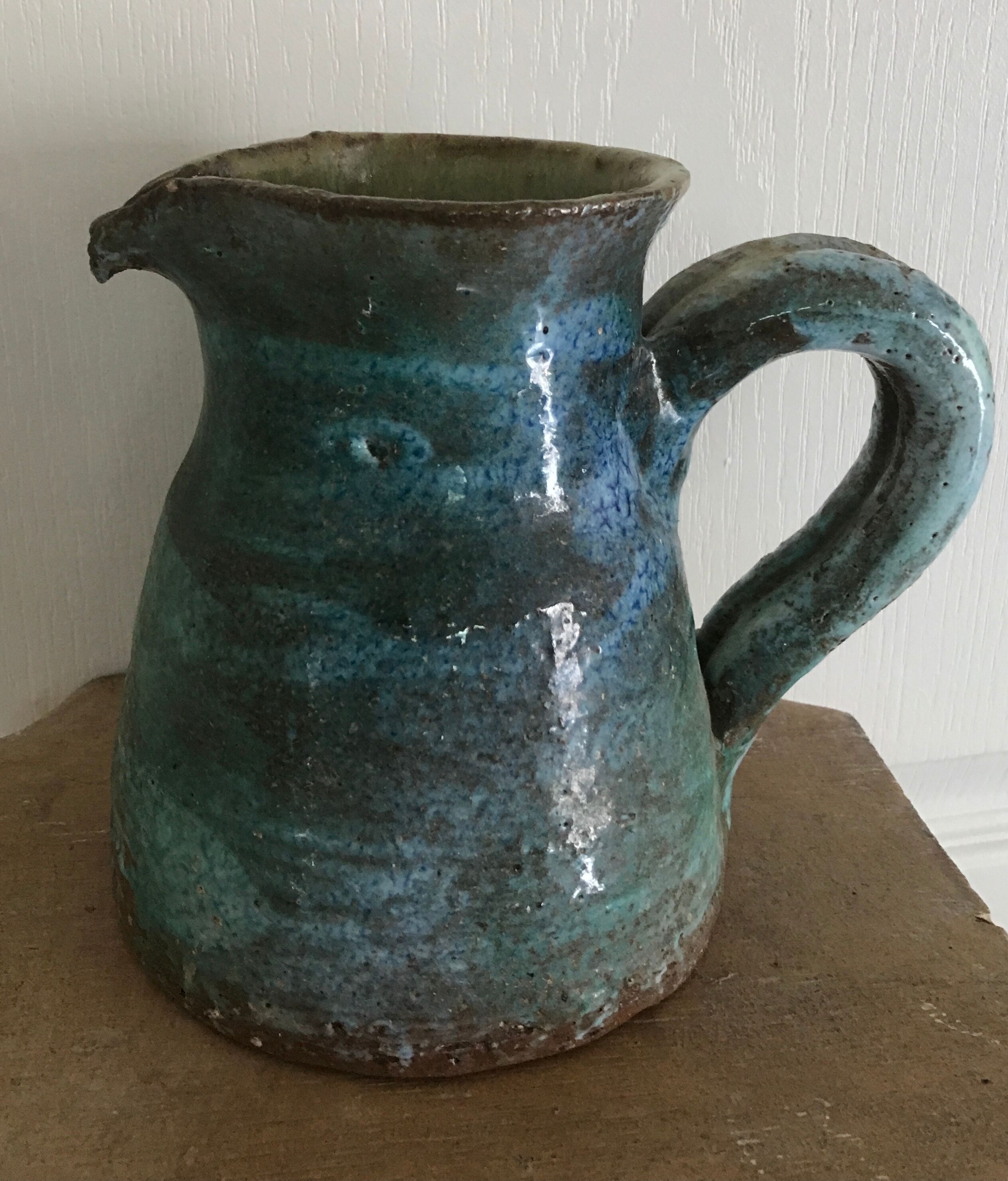 Vintage broc pitcher in enamelled sandstone with effect of blue shades, turquoise green signed