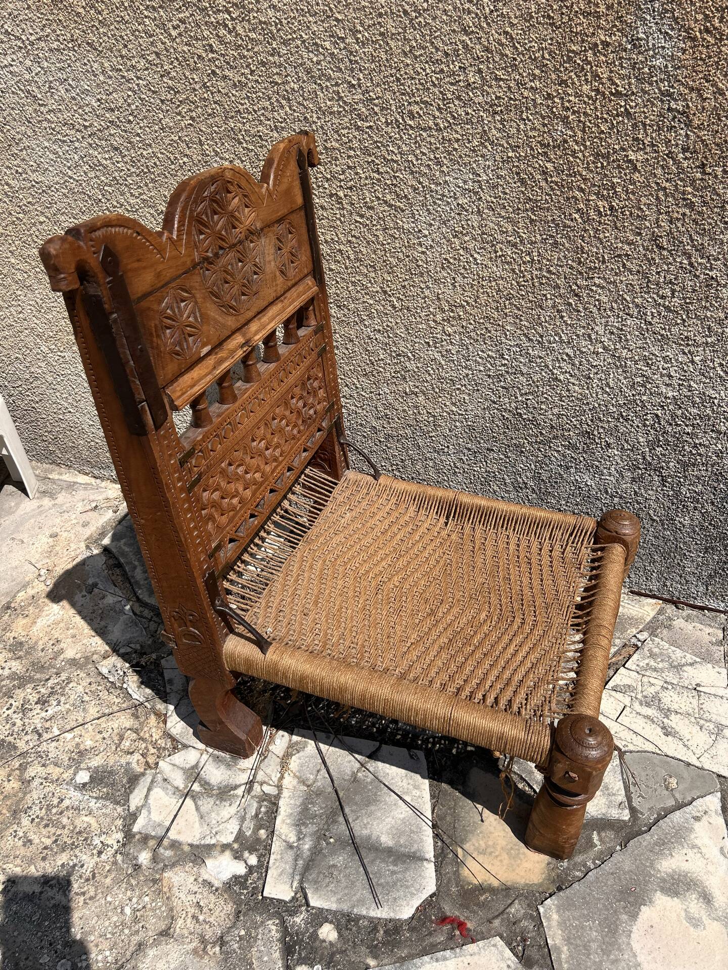 Antique ethnic chair in carved wood