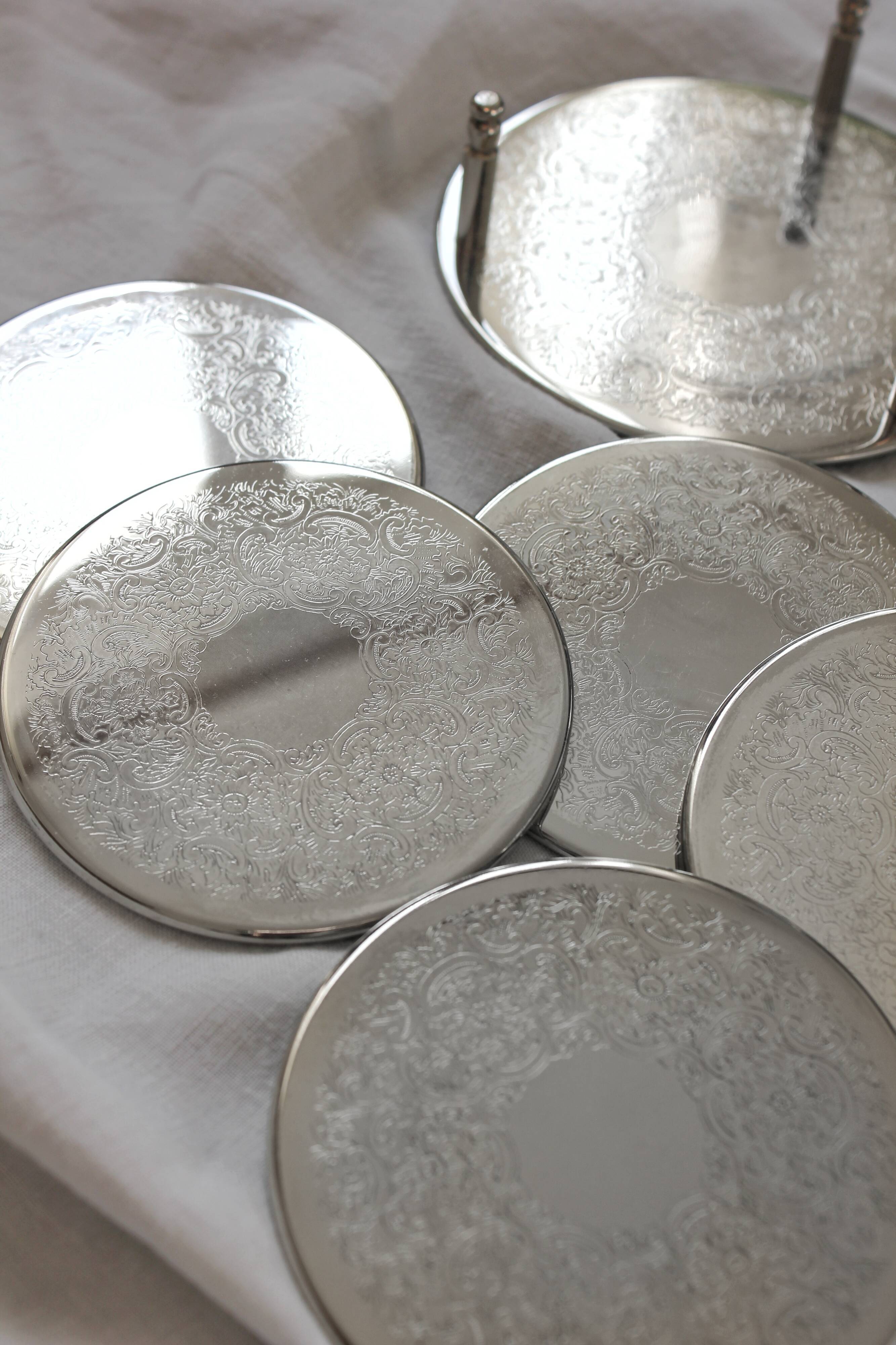 6 vintage chiseled silver metal coasters