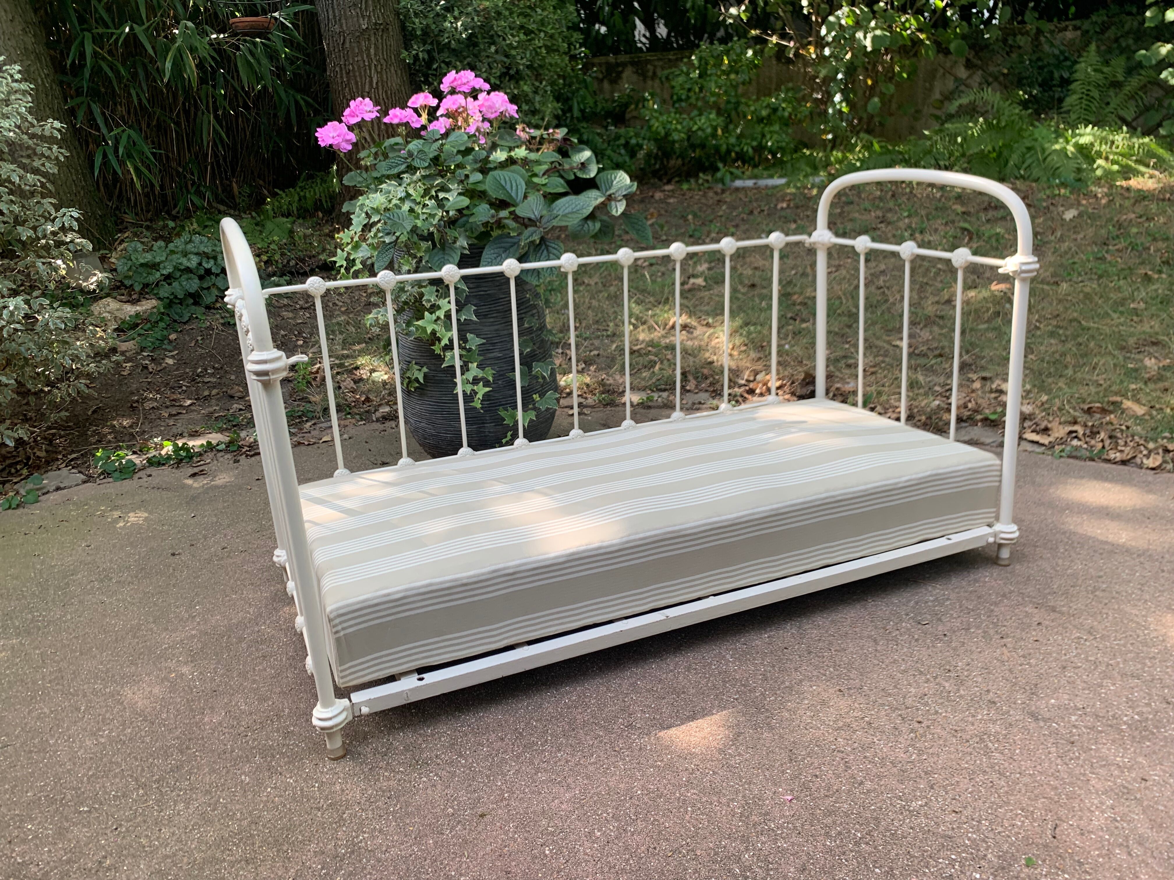 Wrought iron sofa bed with box spring.