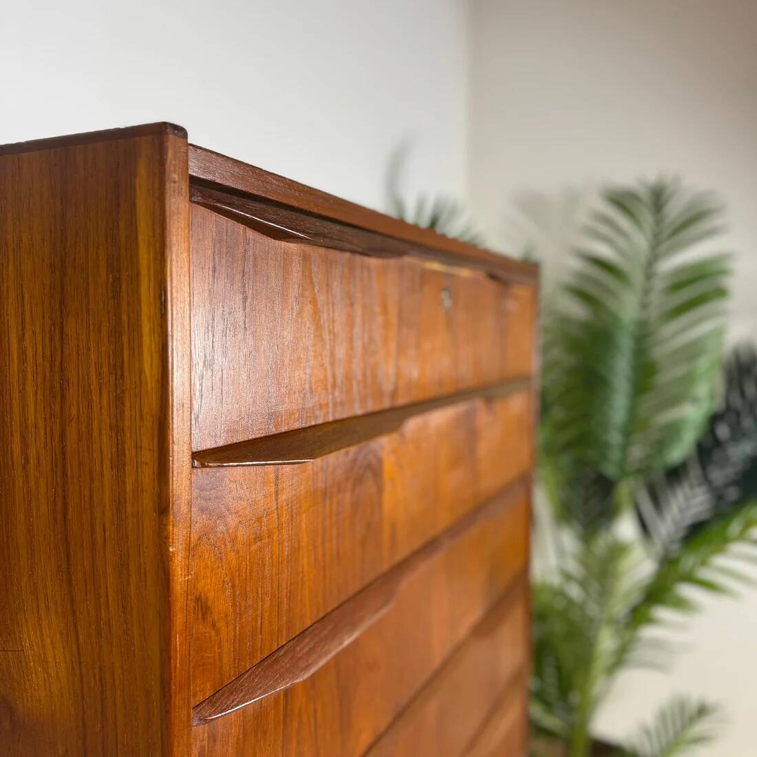Mid-century Danish high chest of drawers with eight teak drawers.