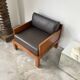 Modernist armchair in exotic wood and leather