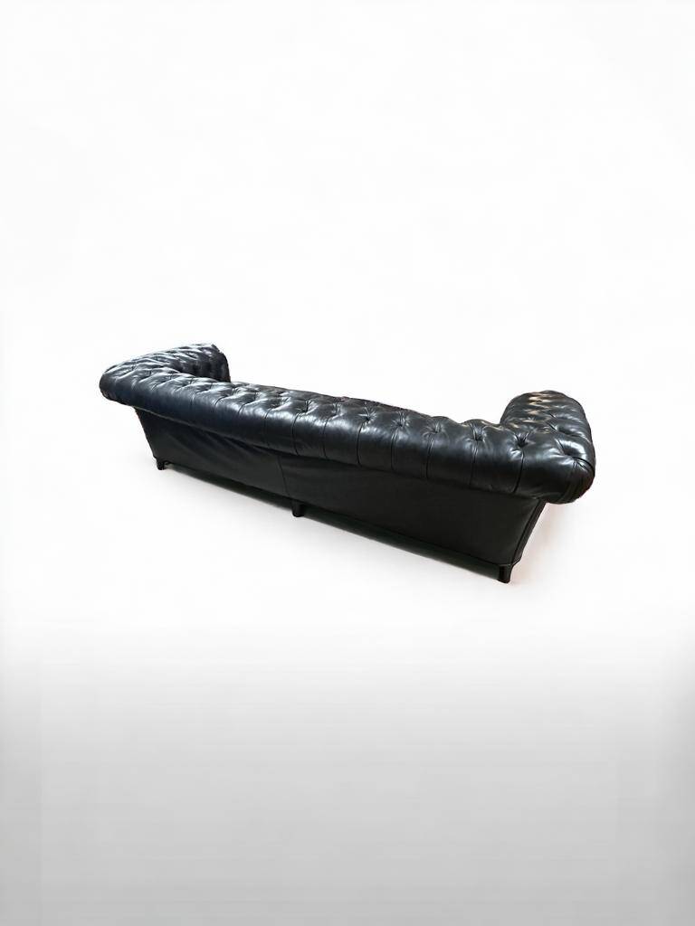 Large and old four-seater leather chesterfield sofa early 20th century l 260 cm